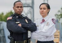 A man and a woman security guard having a pose outdoor