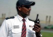 A security Guard in a white uniform